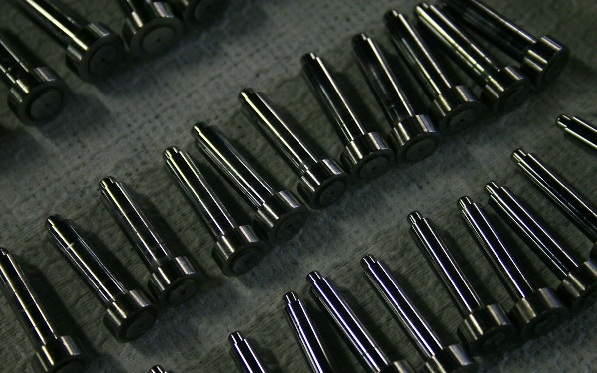 Rows of machined steel pins.